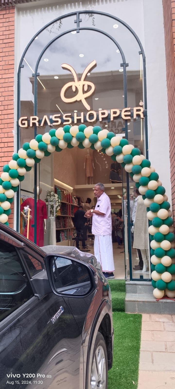 Grasshopper showroom opening with balloon arch by Red Q Events