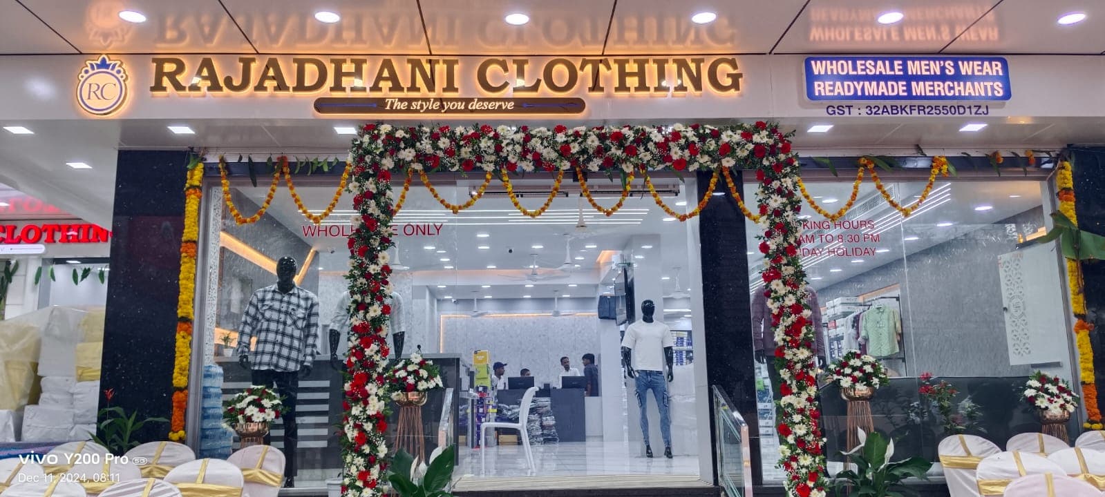 Rajadhani Clothing storefront decorated with floral arch for opening