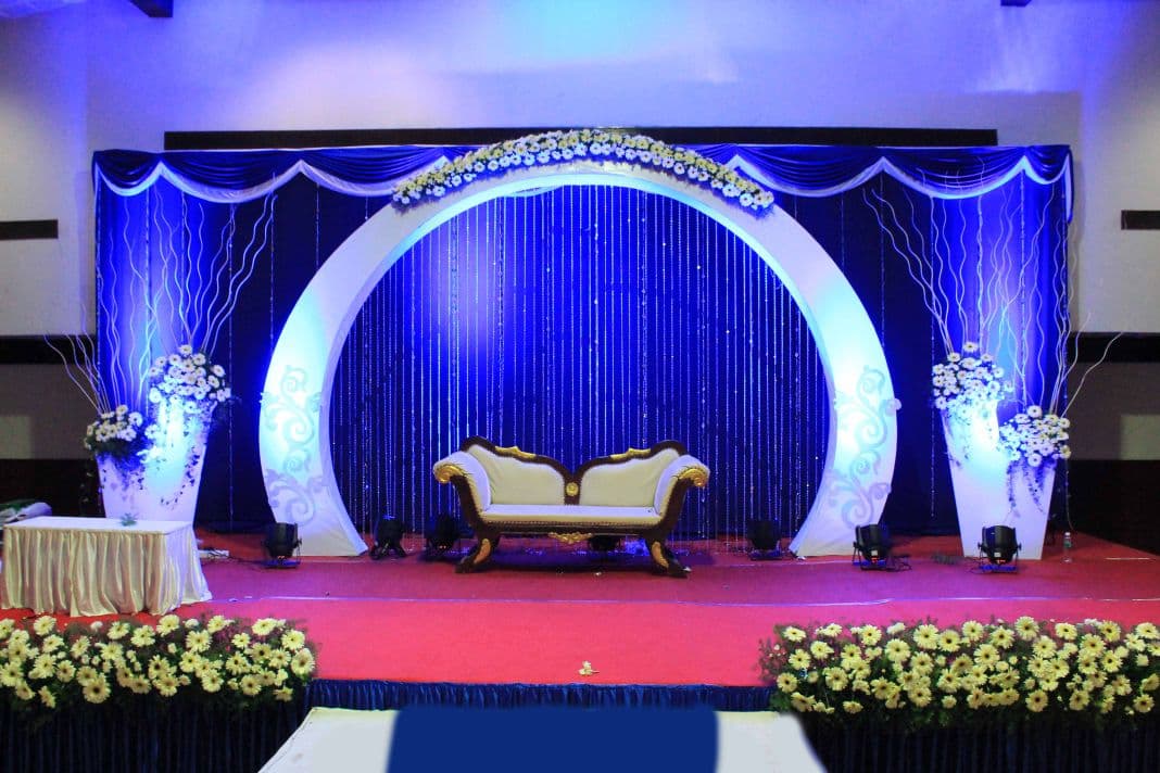 Elegant blue-themed wedding stage planned by Red Q Events in Kerala